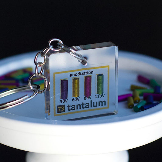 Anodized tantalum keychain 20x40 mm (Ta), 99.9%. 30, 60, 80, 110 volts.